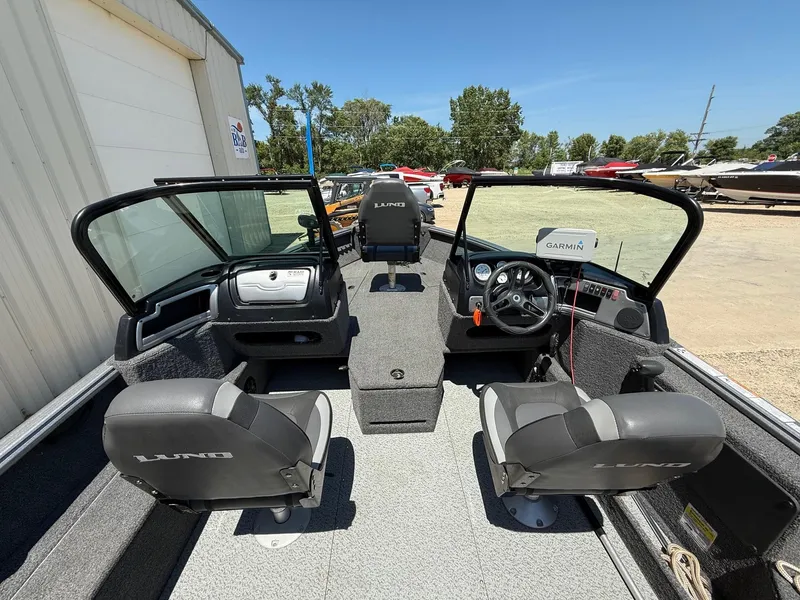 Slide: The Image of 2020 Lund 1775 Impact boat interior with Garmin navigation system and dual seating. - 8