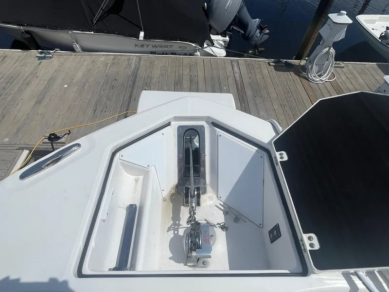 Slide: The Image of Anchor compartment of a 2022 Sea Fox 368 Commander boat at a dock. - 10