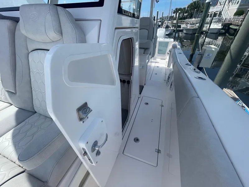 Slide: The Image of 2022 Sea Fox 368 Commander boat interior with open door and seating area. - 15