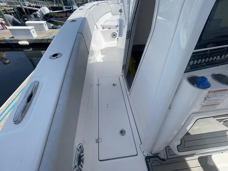 Slide: The Image of 2022 Sea Fox 368 Commander boat interior with seating and storage compartments. - 16