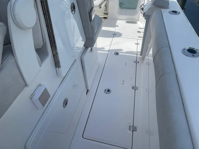 Slide: The Image of 2022 Sea Fox 368 Commander boat interior with storage compartments and seating. - 19