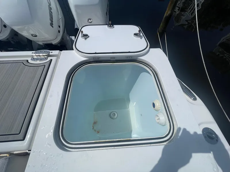 Slide: The Image of Livewell on 2022 Sea Fox 368 Commander boat, with open lid and visible interior. - 30