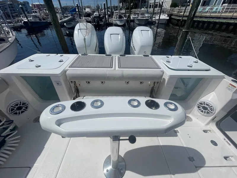 Slide: The Image of 2022 Sea Fox 368 Commander boat deck with fishing rod holders and storage compartments. - 31
