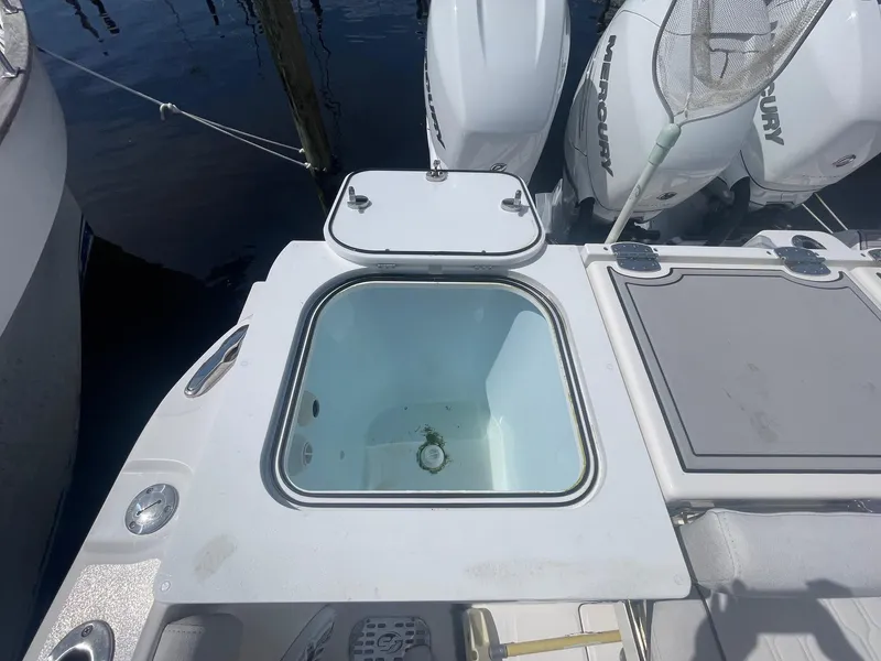 Slide: The Image of 2022 Sea Fox 368 Commander boat with open livewell and Mercury outboard engines. - 33