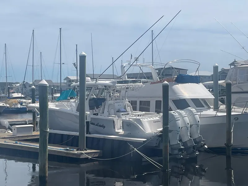 Slide: The Image of 2022 Sea Fox 368 Commander docked at marina with other boats. - 38