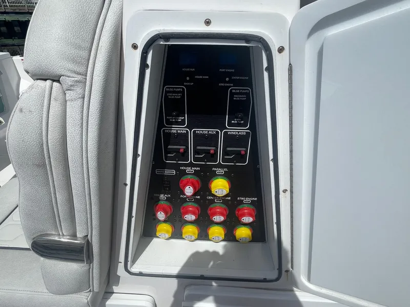 Slide: The Image of Control panel of a 2022 Sea Fox 368 Commander boat with switches and buttons. - 9