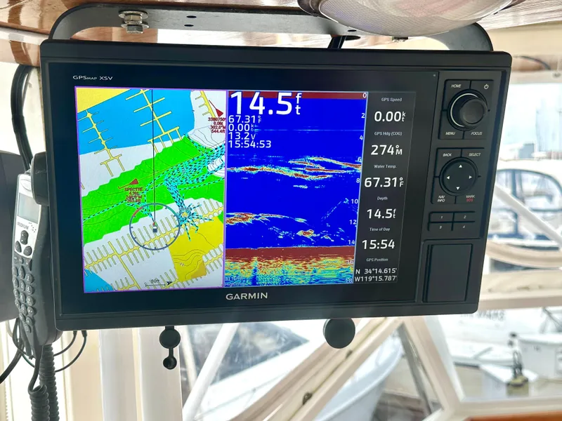 Slide: The Image of Garmin GPS display on 1975 Hatteras Sport Fisher, showing navigation and sonar data. - 25
