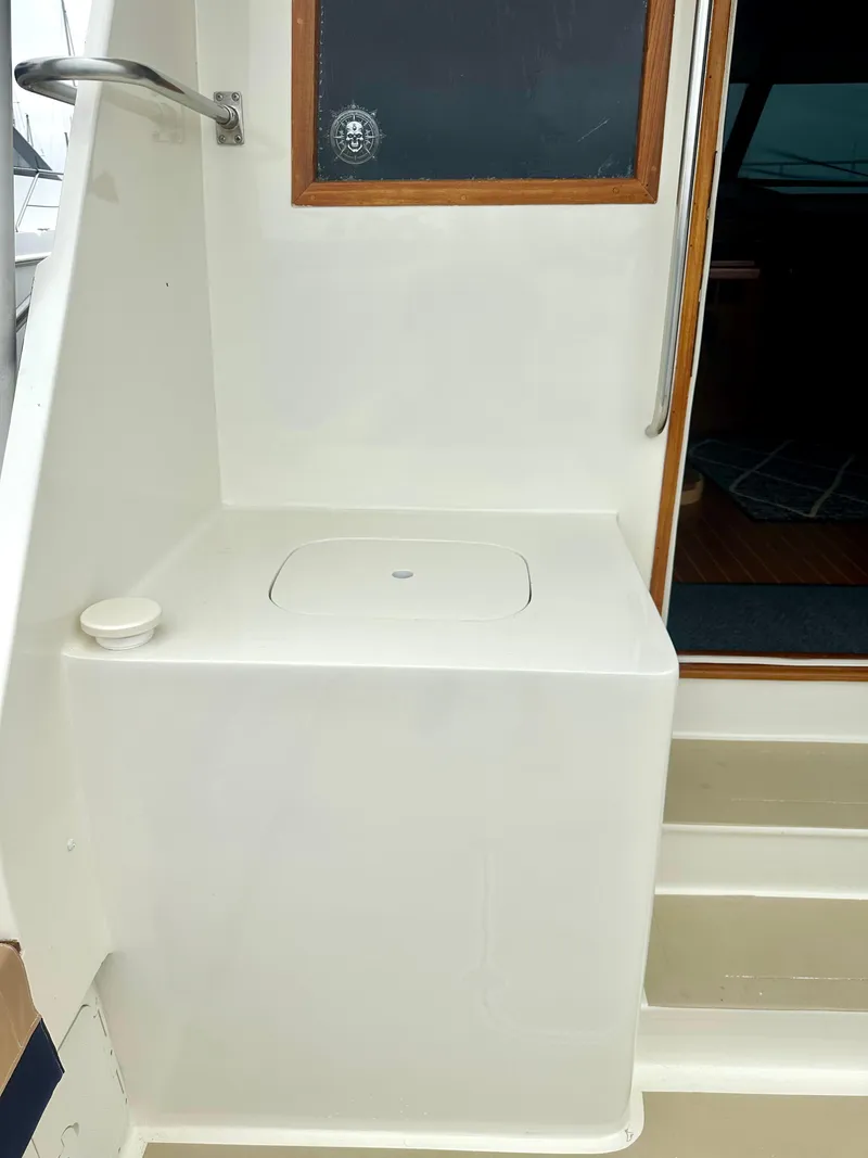 Slide: The Image of 1975 Hatteras Sport Fisher boat interior with steps and storage compartment. - 28