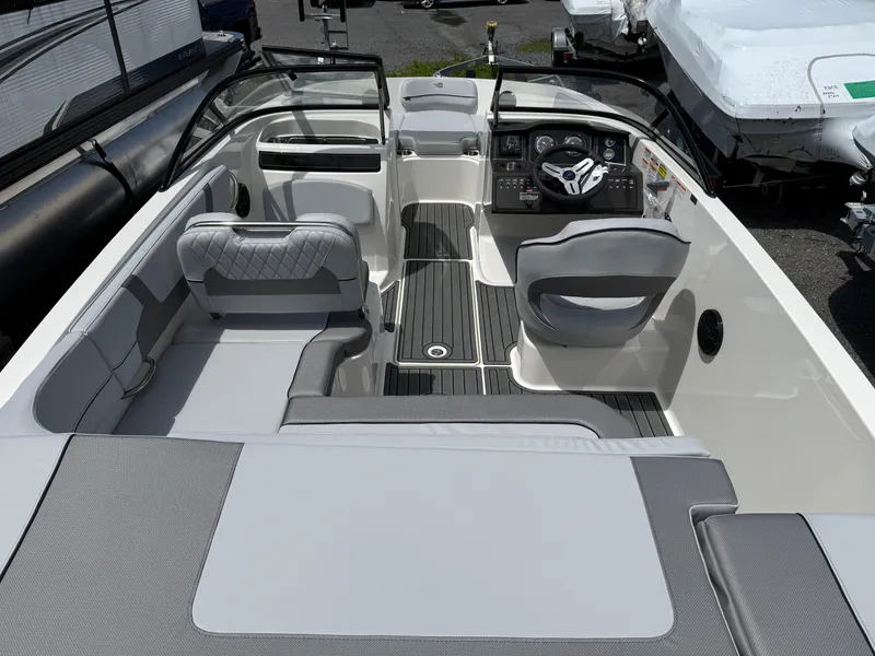 Slide: The Image of 2025 Bayliner VR5 Bowrider I/O interior with sleek seating and modern dashboard design. - 1