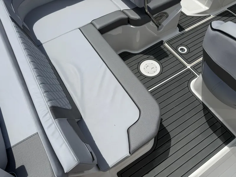 Slide: The Image of 2025 Bayliner VR5 Bowrider I/O interior with sleek seating and modern flooring design. - 4