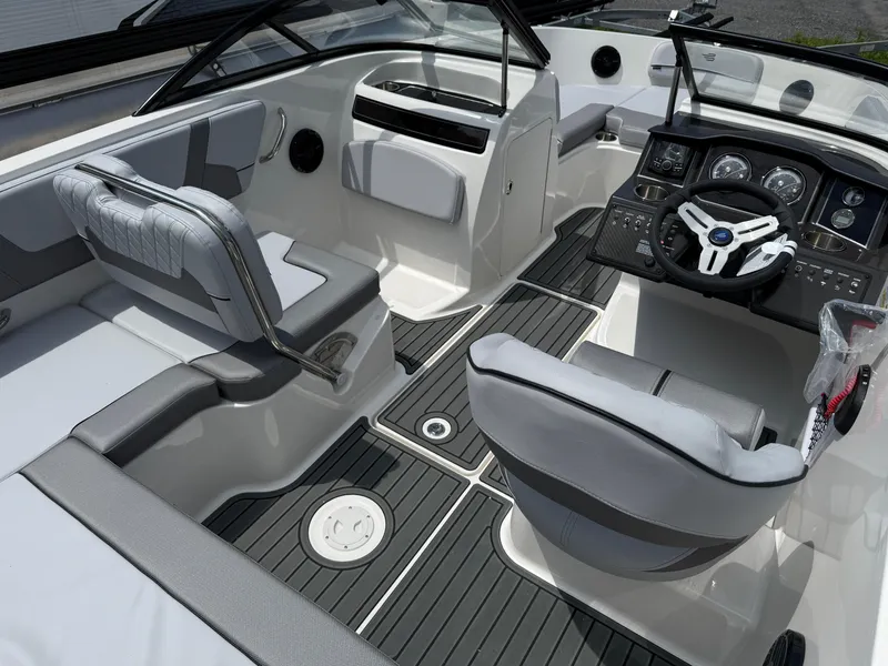 Slide: The Image of 2025 Bayliner VR5 Bowrider I/O interior with modern dashboard and seating. - 5