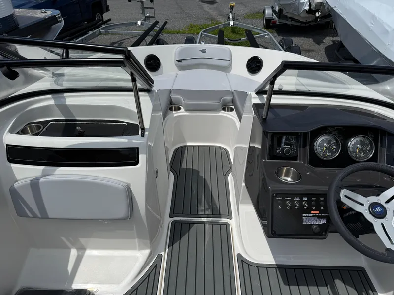 Slide: The Image of 2025 Bayliner VR5 Bowrider I/O interior with sleek dashboard and modern controls. - 8
