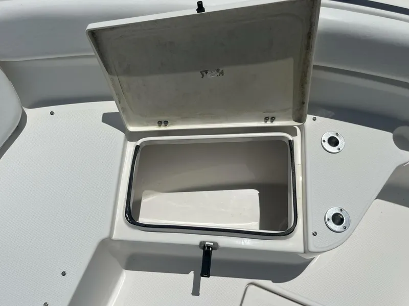 Slide: The Image of Open storage compartment on a 2014 Sea Fox COMMANDER boat deck. - 14