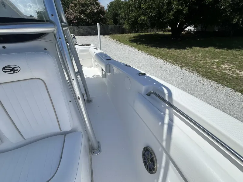 Slide: The Image of 2014 Sea Fox COMMANDER boat interior with white seating and metal railings. - 18