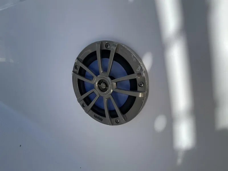 Slide: The Image of Boat speaker on 2014 Sea Fox COMMANDER, featuring a metallic grille and blue interior. - 19
