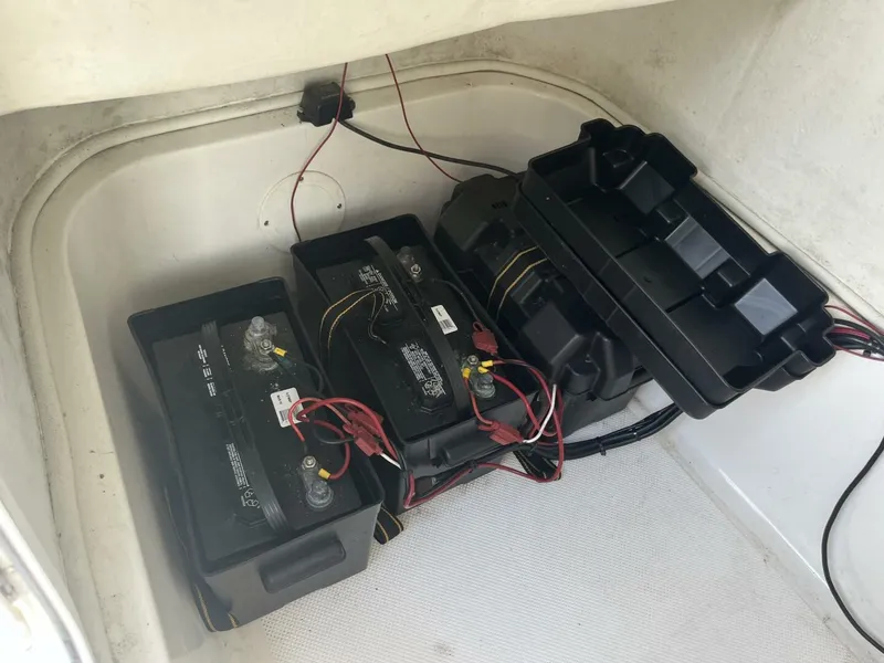 Slide: The Image of Batteries in a 2014 Sea Fox COMMANDER boat compartment with wiring connections. - 22
