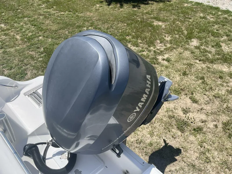 Slide: The Image of Yamaha outboard motor on 2014 Sea Fox COMMANDER boat, parked on grassy area. - 34