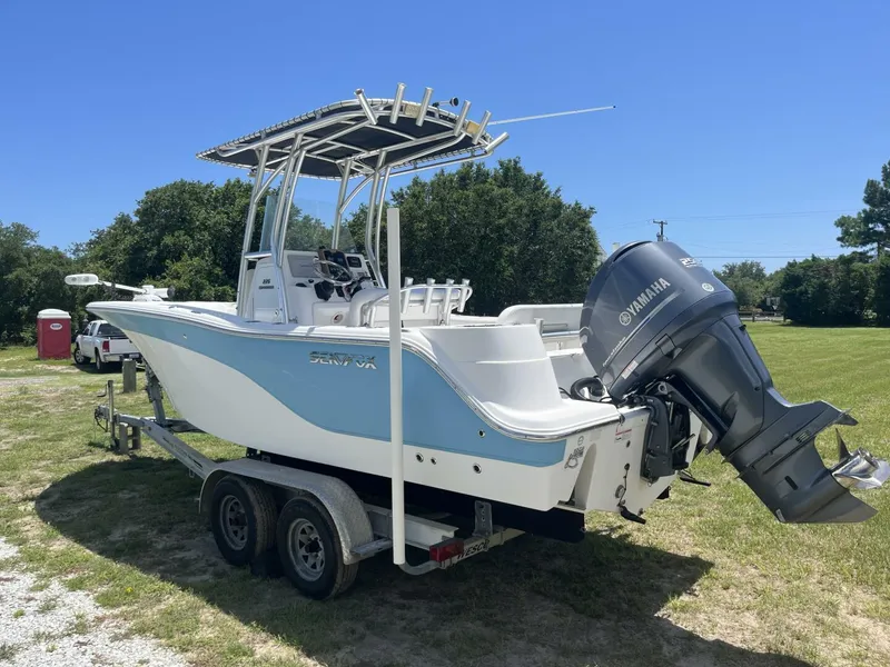 Slide: The Image of 2014 Sea Fox COMMANDER boat on trailer with Yamaha outboard motor, parked on grass. - 5