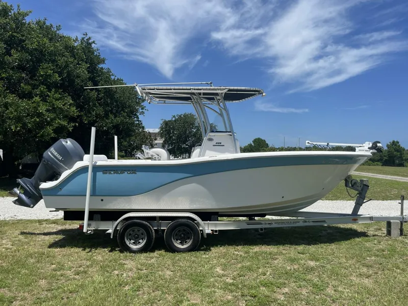 Slide: The Image of 2014 Sea Fox COMMANDER boat on trailer, parked on grass under blue sky. - 8
