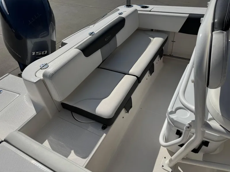 Slide: The Image of 2023 Robalo R202 Explorer boat interior with seating and Yamaha 150 engine. - 11