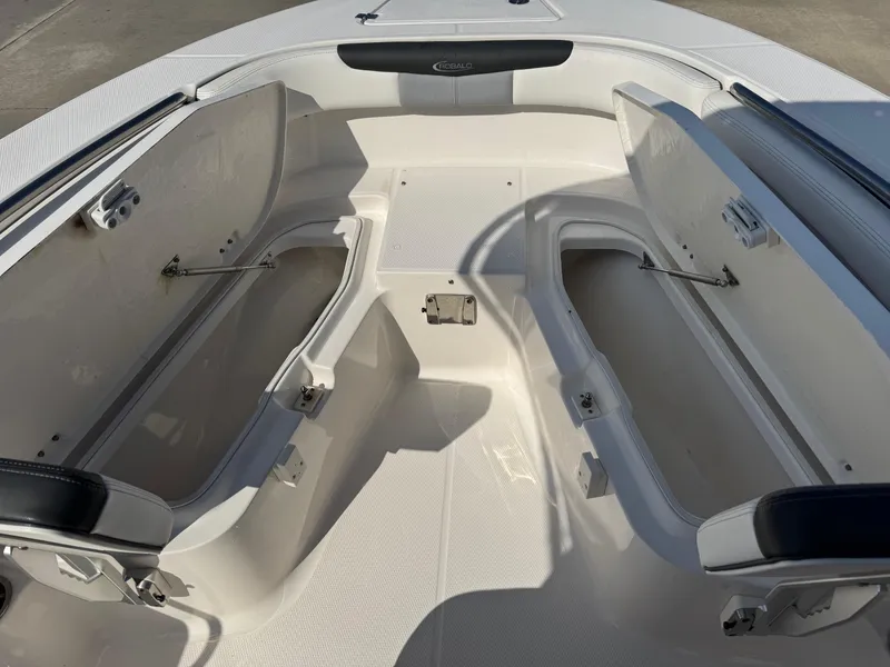 Slide: The Image of 2023 Robalo R202 Explorer boat interior with open storage compartments. - 14