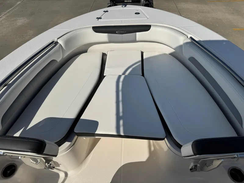 Slide: The Image of 2023 Robalo R202 Explorer boat interior with cushioned seating and sleek design. - 18