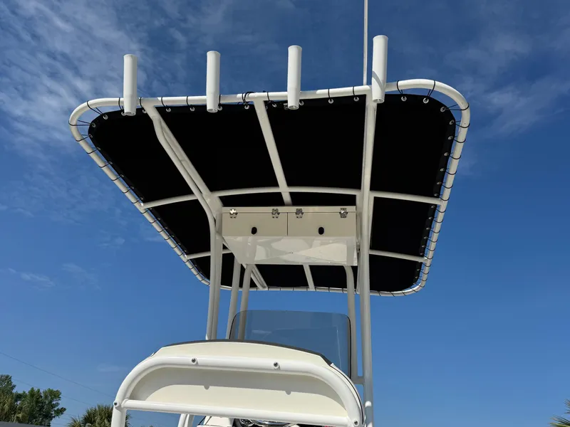 Slide: The Image of 2023 Robalo R202 Explorer boat with T-top against blue sky. - 19