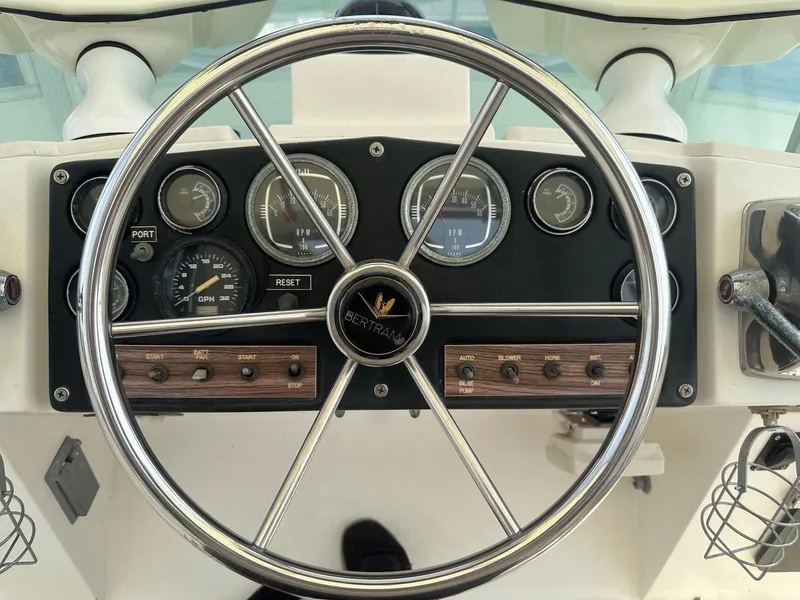 Slide: The Image of Steering wheel and dashboard of a 1978 Bertram 33 Convertible boat. - 10