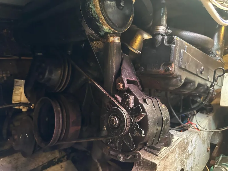 Slide: The Image of Engine compartment of a 1978 Bertram 33 Convertible boat, showing mechanical components. - 28