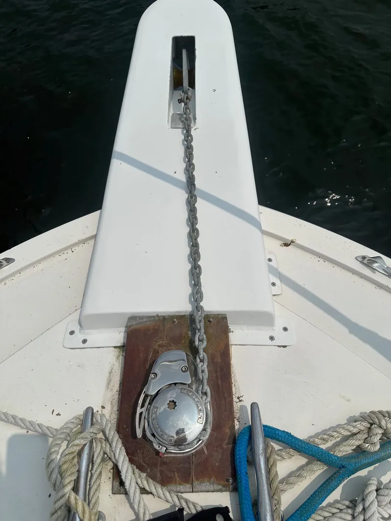 Slide: The Image of Anchor chain and winch on 1978 Bertram 33 Convertible boat deck. - 8