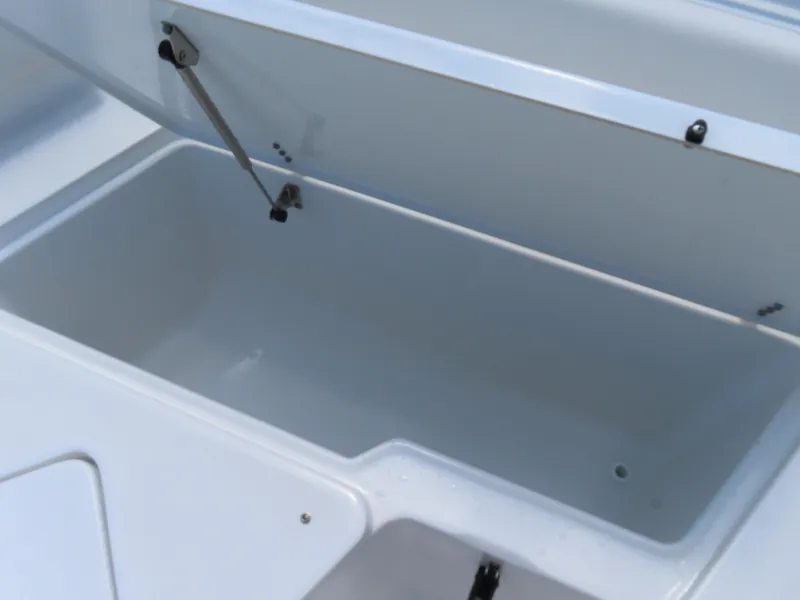 Slide: The Image of Open storage compartment on a 2020 Sea Hunt Ultra 234 boat. - 11