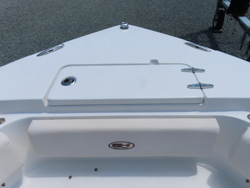 Slide: The Image of 2020 Sea Hunt Ultra 234 boat bow with storage compartment and seating. - 12