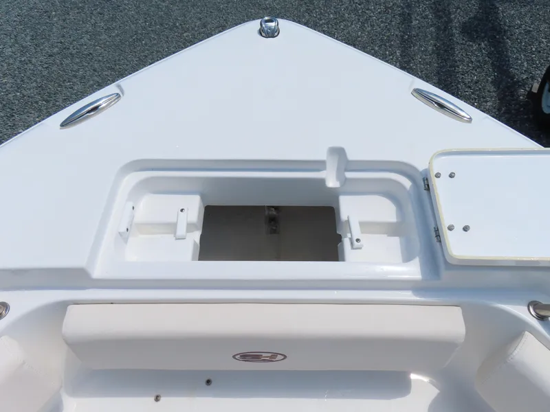 Slide: The Image of Bow area of 2020 Sea Hunt Ultra 234 boat with storage compartment and cleats. - 13
