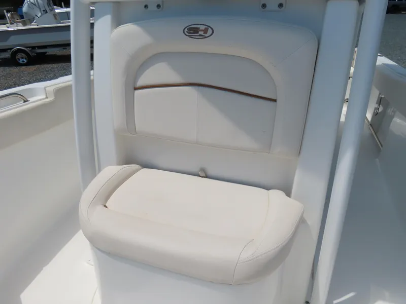 Slide: The Image of 2020 Sea Hunt Ultra 234 boat seat with white upholstery. - 17
