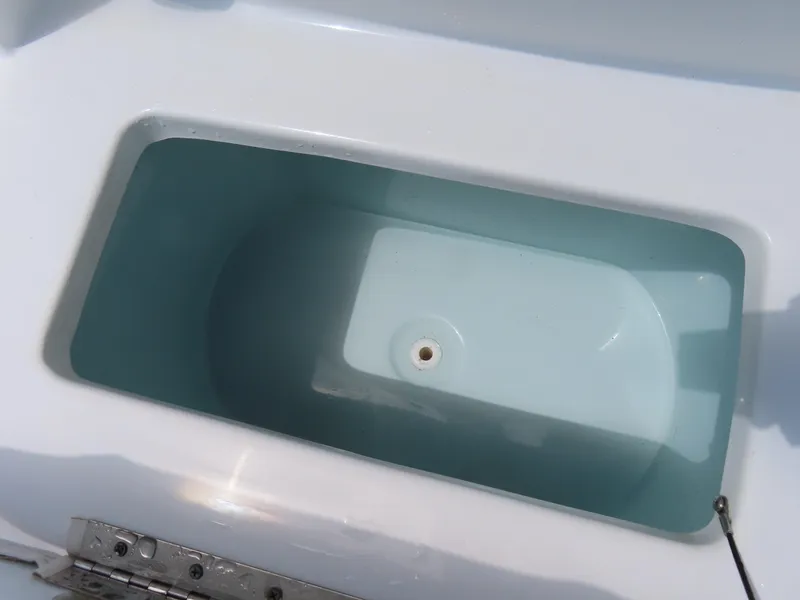 Slide: The Image of Livewell compartment on a 2020 Sea Hunt Ultra 234 boat. - 18