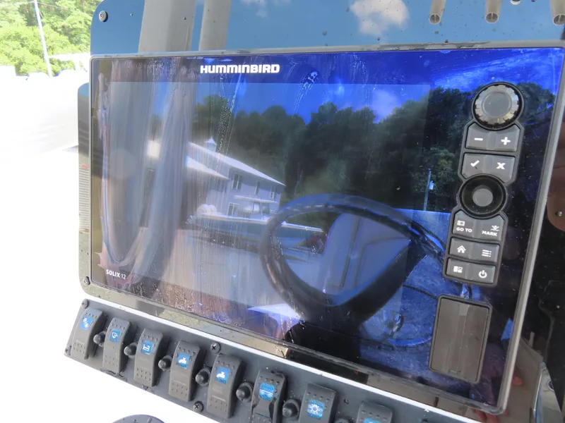 Slide: The Image of Humminbird Solix 12 fishfinder on 2020 Sea Hunt Ultra 234 boat dashboard. - 25