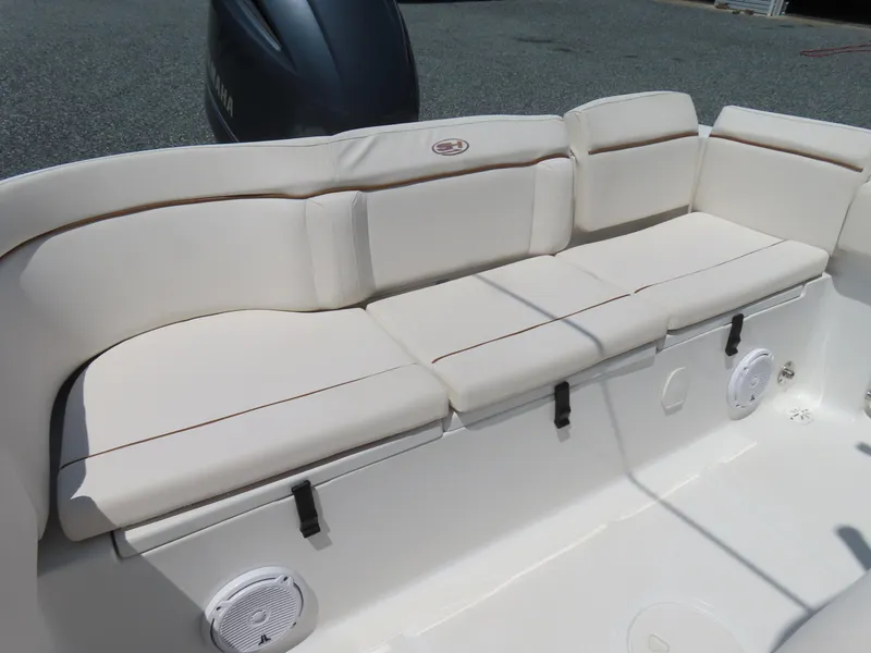 Slide: The Image of 2020 Sea Hunt Ultra 234 boat with cushioned seating and Yamaha engine. - 37