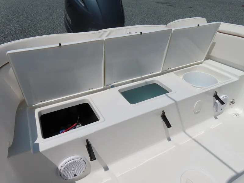 Slide: The Image of 2020 Sea Hunt Ultra 234 boat storage compartments and Yamaha engine detail. - 39
