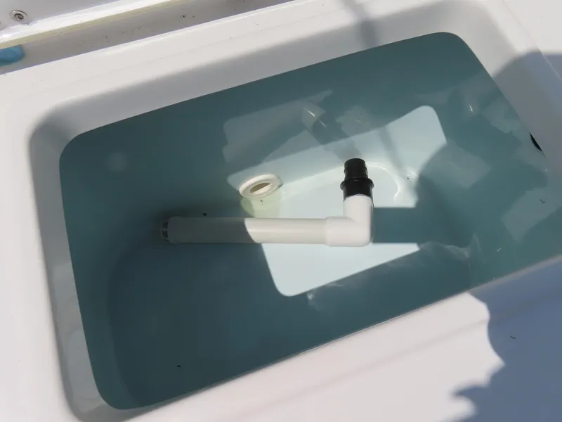 Slide: The Image of Livewell tank in 2020 Sea Hunt Ultra 234 boat, partially filled with water. - 41