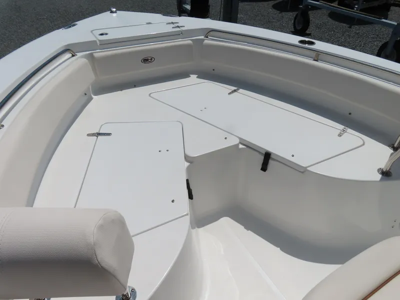 Slide: The Image of 2020 Sea Hunt Ultra 234 boat interior with seating and storage compartments. - 8