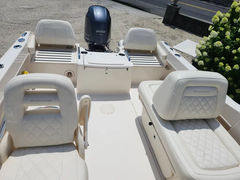 Slide: The Image of 2018 Grady-White Freedom 215 boat interior with seating and Yamaha 200 engine. - 10