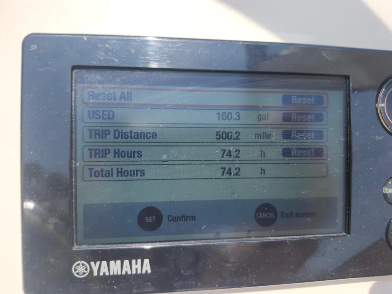Slide: The Image of Yamaha display showing trip data: 160.3 gallons used, 500.2 miles, 74.2 hours. Grady-White Freedom 215. - 19