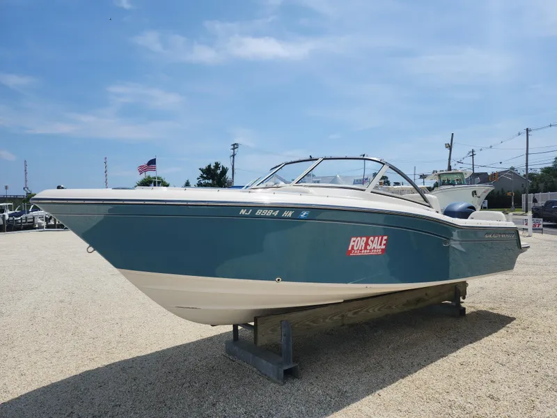 Slide: The Image of 2018 Grady-White Freedom 215 boat for sale, displayed outdoors on a sunny day. - 3