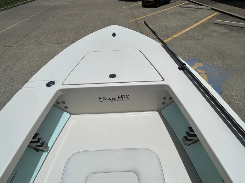 Slide: The Image of 2011 Maverick Mirage 17HPX-Tunnel boat interior, showing clean deck and storage compartments. - 13