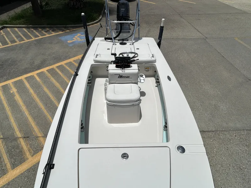 Slide: The Image of 2011 Maverick Mirage 17HPX-Tunnel boat parked in a lot, showcasing sleek design and seating. - 14