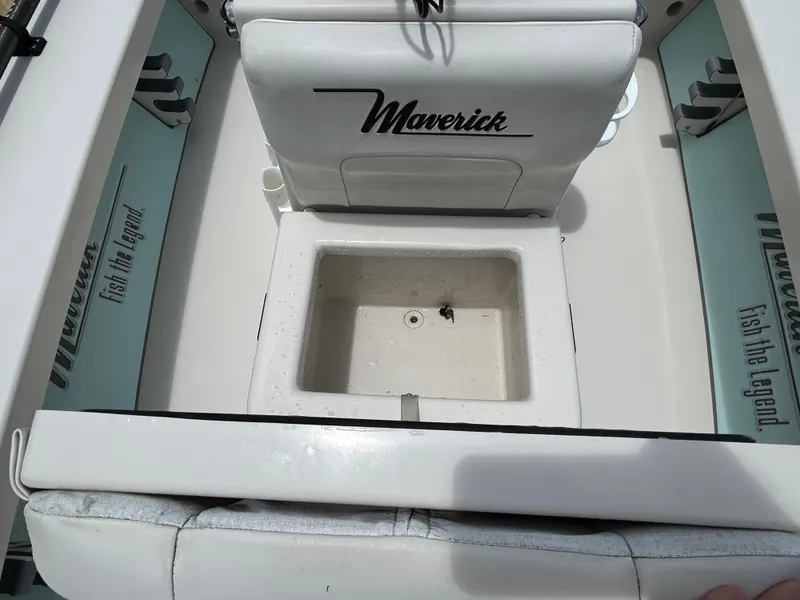Slide: The Image of 2011 Maverick Mirage 17HPX-Tunnel boat interior with storage compartment and branding. - 15