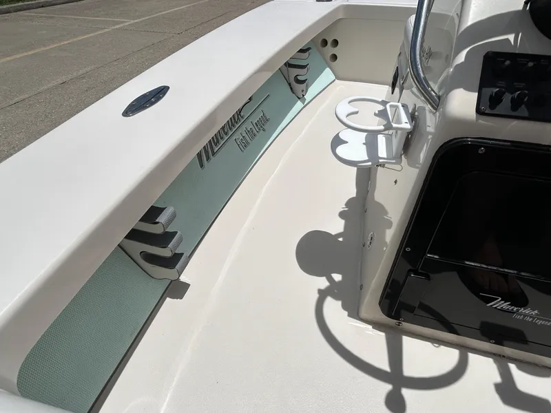 Slide: The Image of 2011 Maverick Mirage 17HPX-Tunnel boat interior with rod holders and cup holders. - 8