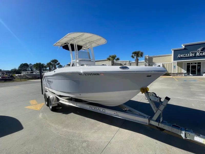 Slide: The Image of 2023 Robalo R202 Explorer boat on trailer at Anglers Marine dealership. - 1