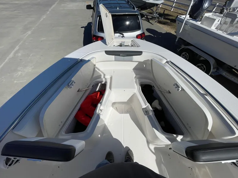 Slide: The Image of 2023 Robalo R202 Explorer boat interior with open storage compartments. - 6