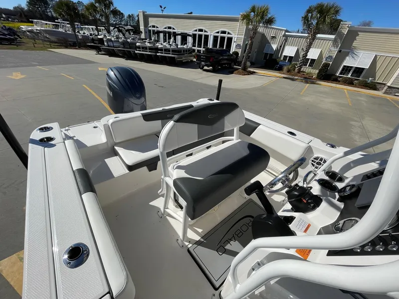 Slide: The Image of 2023 Robalo R202 Explorer boat interior with seating and control panel. - 8